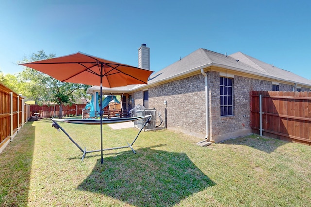 view of yard with a fenced backyard