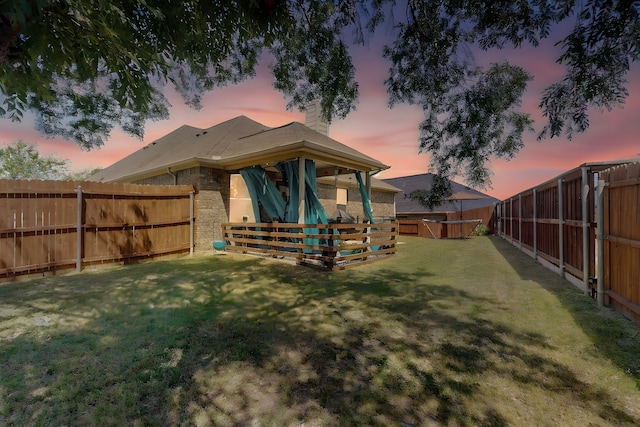 view of yard with a fenced backyard