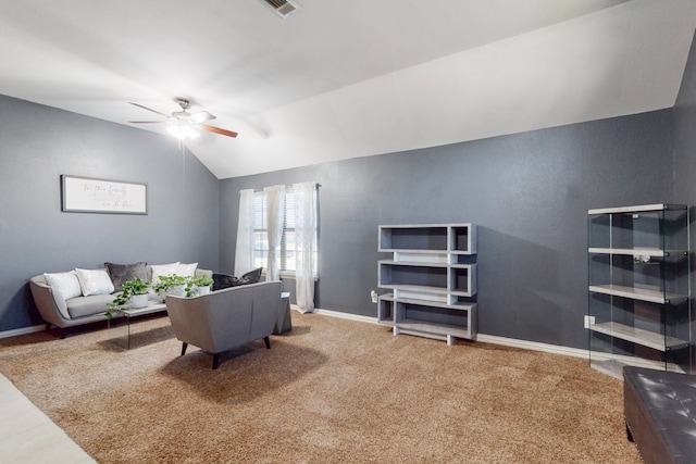 living room with carpet floors, baseboards, a ceiling fan, and lofted ceiling