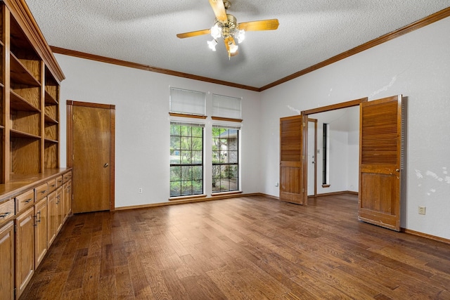 4924 Wolf Creek Trl, Flower Mound, TX 75028 - unfurnished living room featuring dark wood-style flooring, ceiling fan, crown molding, and a textured ceiling