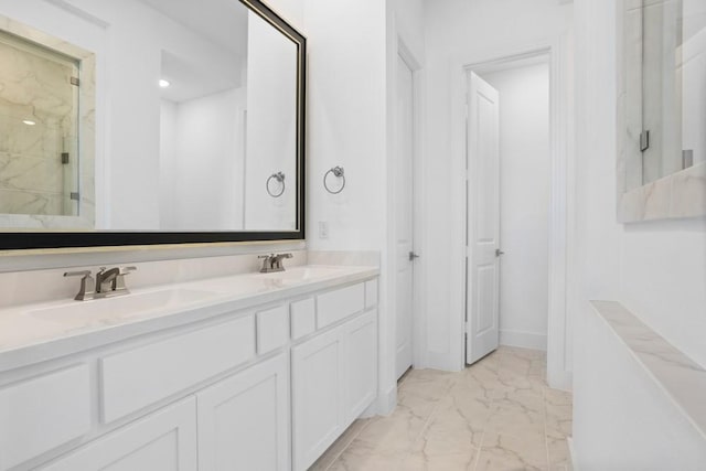 full bathroom with a marble finish shower, marble finish floor, a sink, and double vanity