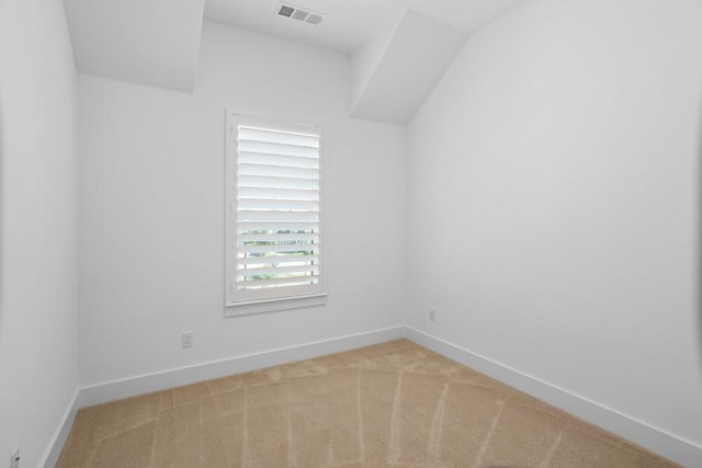 unfurnished room with visible vents, carpet floors, and baseboards