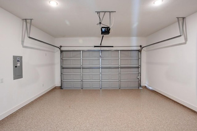 garage featuring a garage door opener, recessed lighting, electric panel, and baseboards