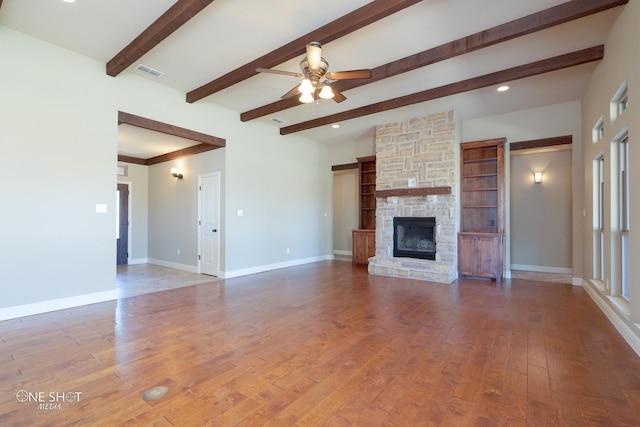 125 Mountain Meadow Dr, Tuscola, TX 79562 - unfurnished living room featuring hardwood / wood-style floors, baseboards, a ceiling fan, and visible vents