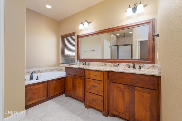 125 Mountain Meadow Dr, Tuscola, TX 79562 - full bathroom featuring a sink, a bath, a shower stall, and double vanity