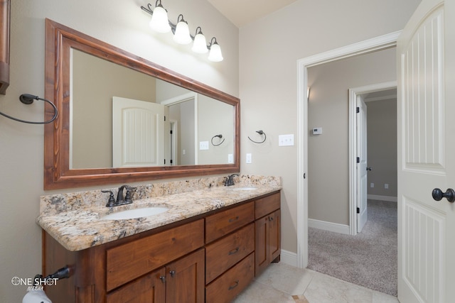 125 Mountain Meadow Dr, Tuscola, TX 79562 - bathroom with tile patterned flooring, double vanity, baseboards, and a sink