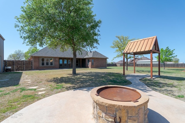125 Mountain Meadow Dr, Tuscola, TX 79562 - view of patio / terrace featuring a fire pit and a fenced backyard
