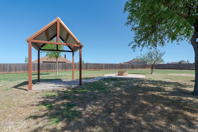 125 Mountain Meadow Dr, Tuscola, TX 79562 - view of yard featuring a fenced backyard, a gazebo, a fire pit, and a patio