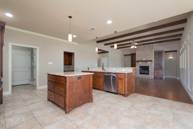 125 Mountain Meadow Dr, Tuscola, TX 79562 - kitchen featuring open floor plan, a kitchen island, brown cabinets, ceiling fan, and dishwasher