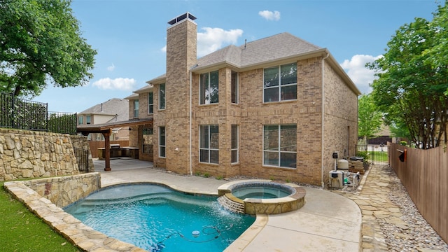 4921 Bob Wills Dr, Fort Worth, TX 76244 - back of property with a patio, a fenced backyard, a chimney, brick siding, and a pool with connected hot tub