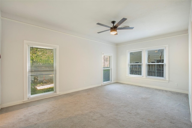 626 N Hampton Rd, Dallas, TX 75208 - carpeted spare room featuring ornamental molding, baseboards, and a ceiling fan