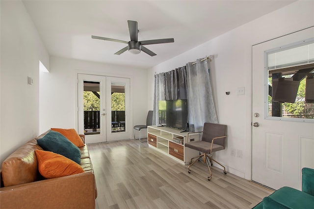 626 N Hampton Rd, Dallas, TX 75208 - living area featuring french doors, light wood finished floors, and a ceiling fan