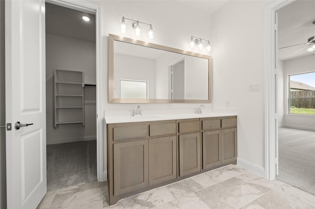 424 Lamb Ln, Waxahachie, TX 75167 - full bath featuring a sink, double vanity, baseboards, a ceiling fan, and marble finish floor
