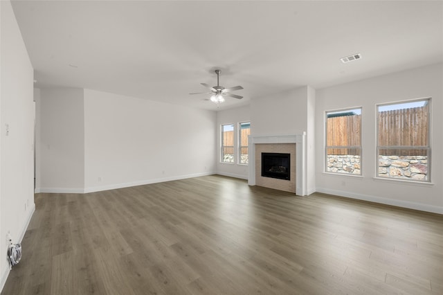424 Lamb Ln, Waxahachie, TX 75167 - unfurnished living room with visible vents, ceiling fan, wood finished floors, and baseboards