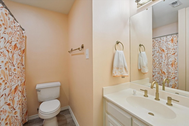 8508 Landing Way Ct, Fort Worth, TX 76179 - bathroom featuring toilet, vanity, baseboards, wood finished floors, and curtained shower