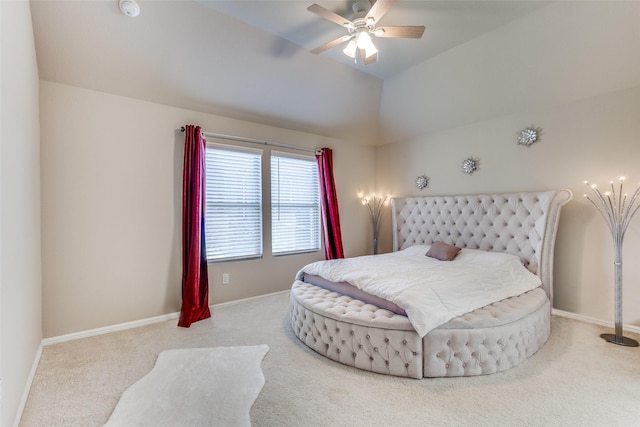 bedroom with baseboards, ceiling fan, carpet, and lofted ceiling