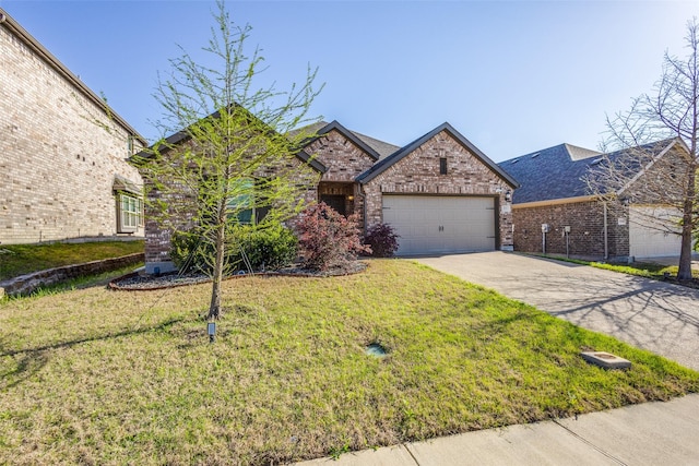 view of front of house featuring brick siding, an attached garage, driveway, and a front lawn