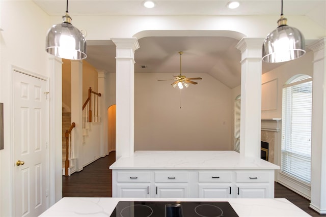 7104 Hillview Dr, Plano, TX 75025 - kitchen featuring ceiling fan, ornate columns, white cabinetry, dark wood finished floors, and vaulted ceiling