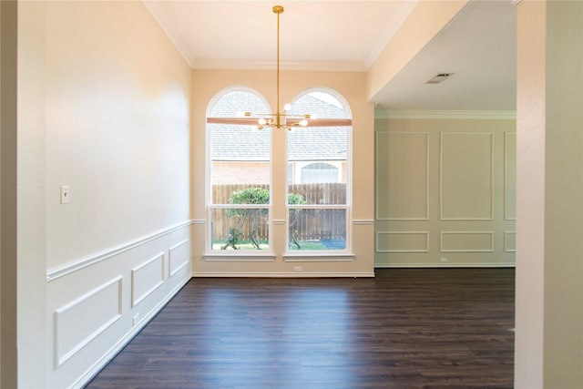 7104 Hillview Dr, Plano, TX 75025 - unfurnished dining area featuring visible vents, crown molding, dark wood-type flooring, and a notable chandelier
