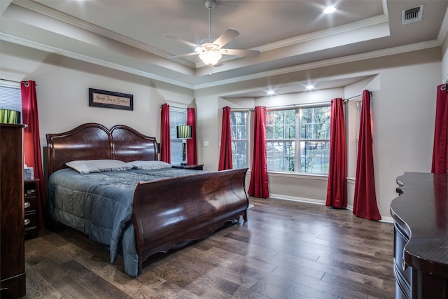 12215 Lake Forest Dr, Azle, TX 76020 - bedroom with a tray ceiling, dark wood-style flooring, crown molding, a ceiling fan, and baseboards