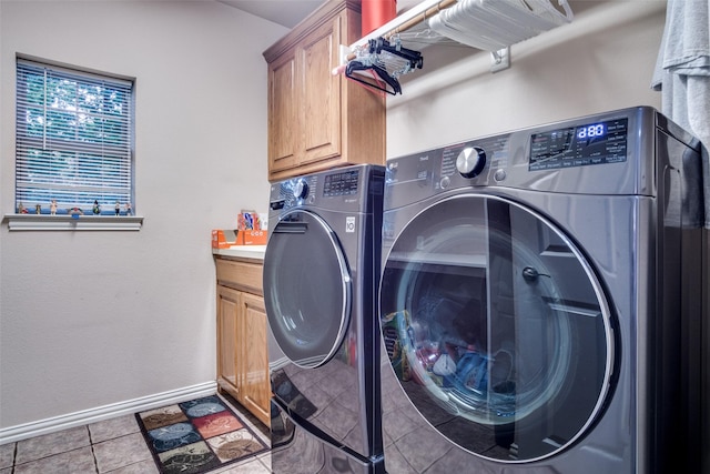 12215 Lake Forest Dr, Azle, TX 76020 - washroom with cabinet space, washing machine and dryer, tile patterned flooring, and baseboards