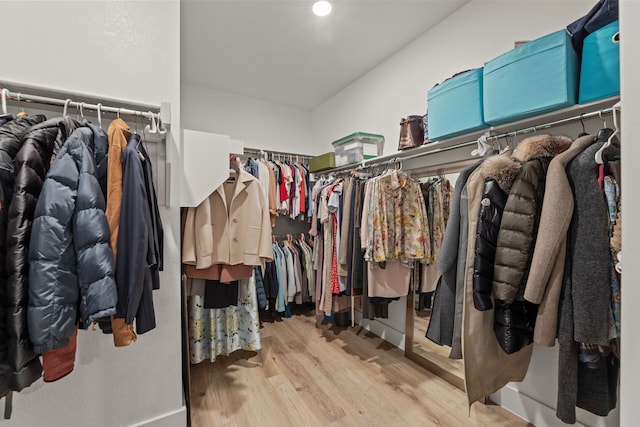 4120 Sandhills Ln, Prosper, TX 75078 - walk in closet with wood finished floors