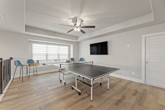 4120 Sandhills Ln, Prosper, TX 75078 - rec room featuring a tray ceiling, ceiling fan, light wood-style flooring, and baseboards