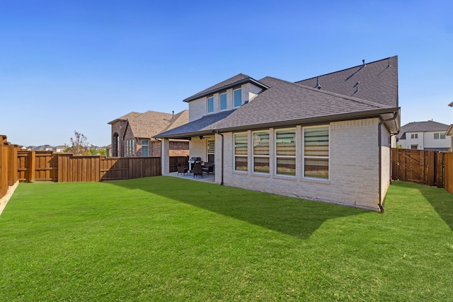 4120 Sandhills Ln, Prosper, TX 75078 - rear view of house featuring roof with shingles, brick siding, and a patio area