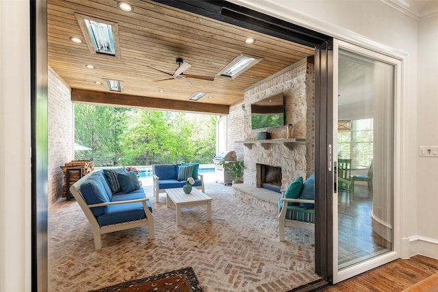 6405 Carmel Falls Ct, Mckinney, TX 75072 - view of patio / terrace with a ceiling fan, an outdoor living space with a fireplace, and area for grilling