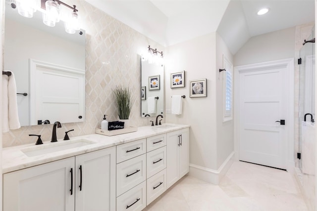 6405 Carmel Falls Ct, Mckinney, TX 75072 - bathroom with a shower stall, double vanity, decorative backsplash, and a sink
