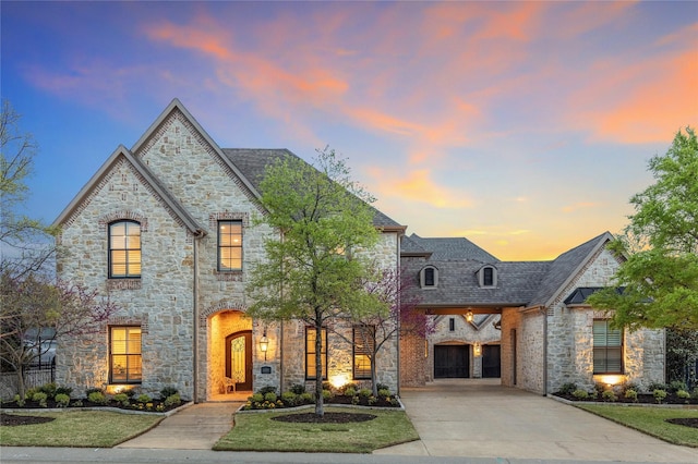 6405 Carmel Falls Ct, Mckinney, TX 75072 - french country style house with a lawn, driveway, and stone siding