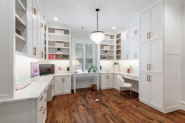 6405 Carmel Falls Ct, Mckinney, TX 75072 - office with dark wood-style floors, an inviting chandelier, built in study area, visible vents, and ornamental molding