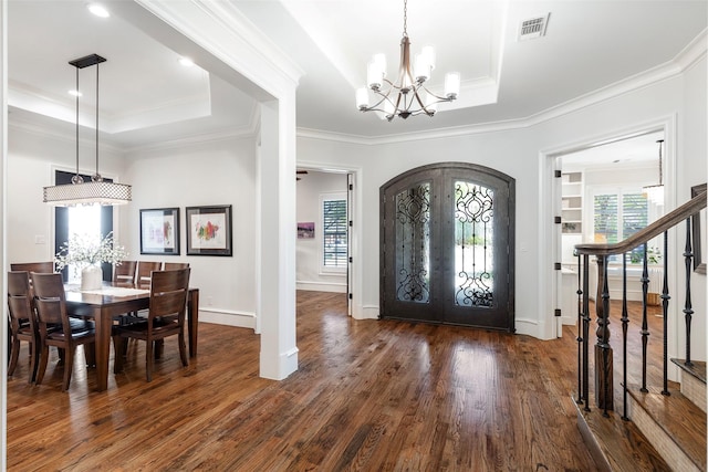 6405 Carmel Falls Ct, Mckinney, TX 75072 - foyer entrance featuring french doors, visible vents, wood finished floors, a raised ceiling, and a chandelier