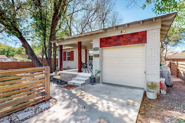 2931 Garapan Dr, Dallas, TX 75224 - view of front of house featuring brick siding, driveway, and fence
