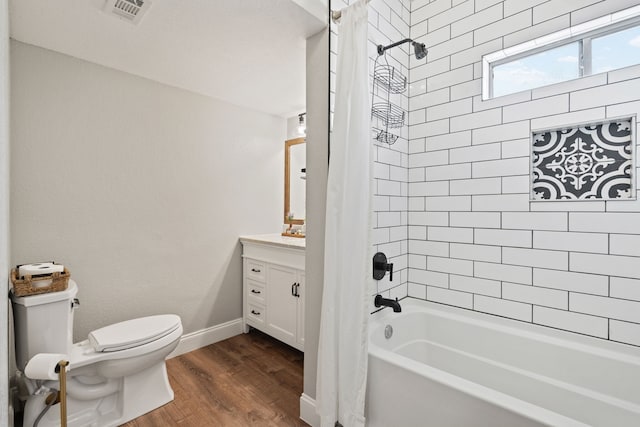 3901 Travis St Unit 121, Dallas, TX 75204 - full bathroom with shower / bathtub combination with curtain, vanity, and wood finished floors