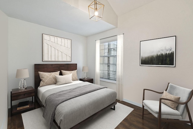 3901 Travis St Unit 121, Dallas, TX 75204 - bedroom featuring dark wood finished floors and vaulted ceiling