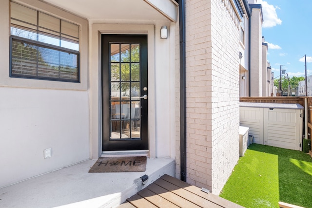 3901 Travis St Unit 121, Dallas, TX 75204 - property entrance with brick siding