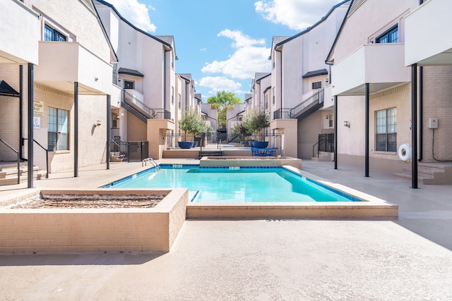 3901 Travis St Unit 121, Dallas, TX 75204 - community pool featuring a residential view and a patio