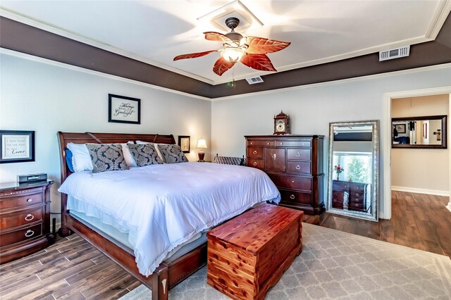 1470 Meandering Way, Rockwall, TX 75087 - bedroom with visible vents, a ceiling fan, and dark wood-style flooring
