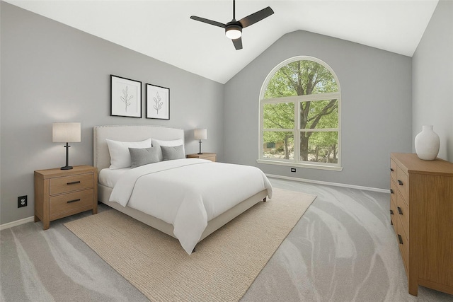 bedroom with baseboards, light colored carpet, and vaulted ceiling