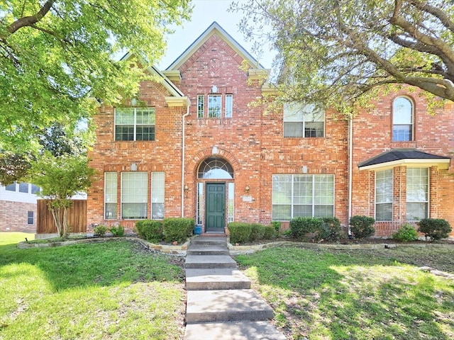 3304 Springbridge Ln, Plano, TX 75025 - traditional home featuring a front lawn and brick siding