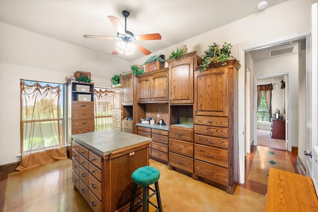 walk in closet with ceiling fan and visible vents