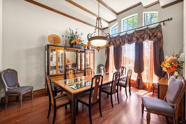 dining space featuring beamed ceiling, wood finished floors, a high ceiling, and ornamental molding