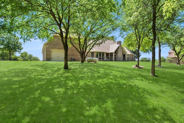 view of yard with a garage
