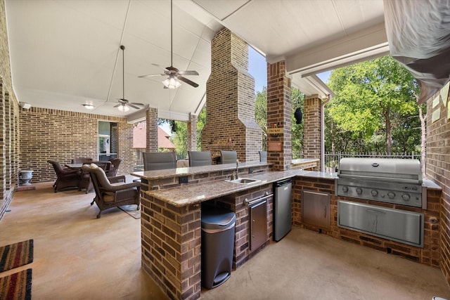 view of patio / terrace featuring grilling area, area for grilling, ceiling fan, and a sink