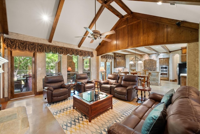living area featuring high vaulted ceiling, ceiling fan, arched walkways, beamed ceiling, and a fireplace