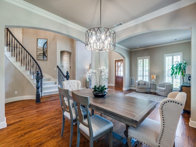 7212 Millard Pond Dr, Mckinney, TX 75071 - dining space featuring arched walkways, baseboards, visible vents, and stairway
