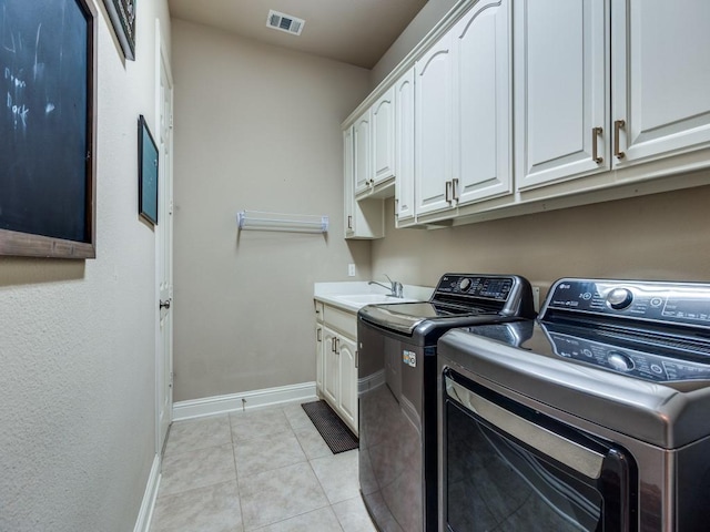 7212 Millard Pond Dr, Mckinney, TX 75071 - clothes washing area with separate washer and dryer, baseboards, light tile patterned floors, visible vents, and cabinet space