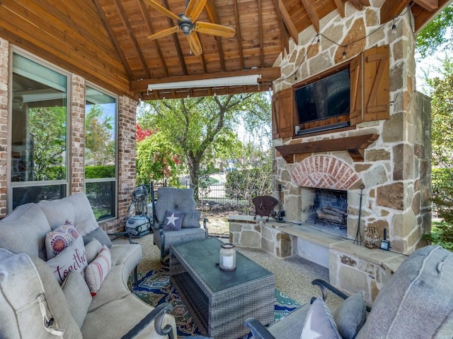 7212 Millard Pond Dr, Mckinney, TX 75071 - view of patio / terrace with ceiling fan, an outdoor living space with a fireplace, and fence