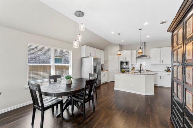 7600 W Fork Ln, Mckinney, TX 75071 - dining area with dark wood-type flooring and recessed lighting